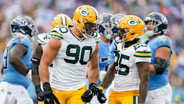 Green Bay Packers defensive end Lukas Van Ness (90) celebrates sacking Tennessee Titans quarterback Will Levis with cornerback Keisean Nixon (25) during the second quarter at Nissan Stadium in Nashville, Tenn., Sunday, Sept. 22, 2024.