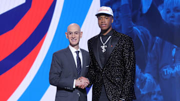 Jun 25, 2025; Brooklyn, NY, USA;  Thomas Sorber stands with NBA commissioner Adam Silver after being selected as the 15th pick by the Oklahoma City Thunder in the first round of the 2025 NBA Draft at Barclays Center.