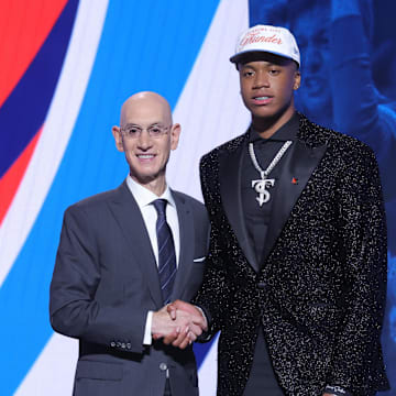 Jun 25, 2025; Brooklyn, NY, USA;  Thomas Sorber stands with NBA commissioner Adam Silver after being selected as the 15th pick by the Oklahoma City Thunder in the first round of the 2025 NBA Draft at Barclays Center. Mandatory Credit: Brad Penner-Imagn Images