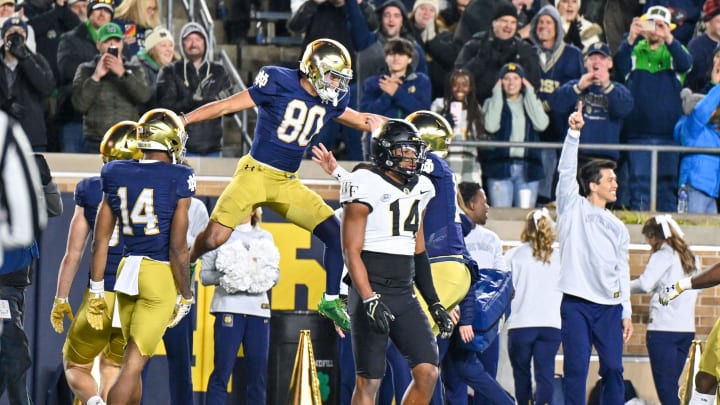 Nov 18, 2023; South Bend, Indiana, USA; Notre Dame Fighting Irish wide receiver Jordan Faison (80) celebrates after catching a pass for a touchdown in the fourth quarter against the Wake Forest Demon Deacons at Notre Dame Stadium. Mandatory Credit: Matt Cashore-USA TODAY Sports