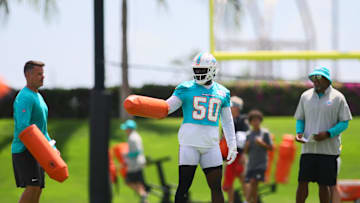 Miami Dolphins linebacker Mohamed Kamara (50) works out during mandatory minicamp at Baptist Health Training Complex.