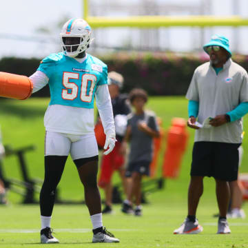 Miami Dolphins linebacker Mohamed Kamara (50) works out during mandatory minicamp at Baptist Health Training Complex.