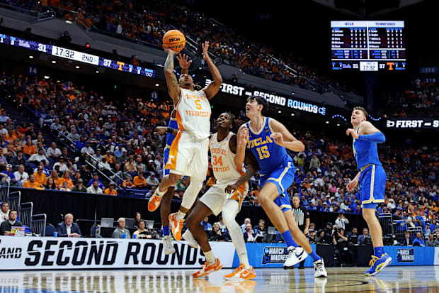 Tennessee Volunteers guard Zakai Zeigler (5) shoots the ball against UCLA Bruins center Aday Mara (15).