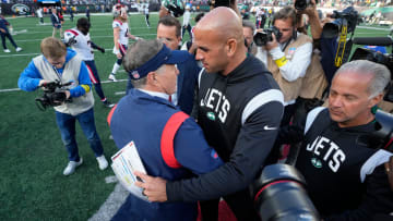 Patriots Head Coach Bill Belichick and Jets Head Coach Robert Saleh, share a hug after New England