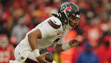 Jan 18, 2025; Kansas City, Missouri, USA; Houston Texans quarterback C.J. Stroud (7) scrambles with the ball against the Kansas City Chiefs during the second quarter of a 2025 AFC divisional round game at GEHA Field at Arrowhead Stadium. Mandatory Credit: Jay Biggerstaff-Imagn Images