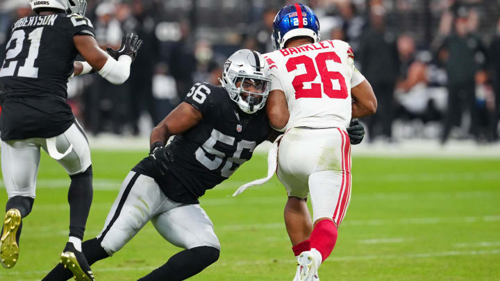 Nov 5, 2023; Paradise, Nevada, USA; Las Vegas Raiders linebacker Amari Burney (56) tackles New York Giants running back Saquon Barkley (26) during the fourth quarter at Allegiant Stadium. Mandatory Credit: Stephen R. Sylvanie-USA TODAY Sports