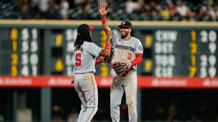 Jun 21, 2024; Denver, Colorado, USA; Washington Nationals shortstop CJ Abrams (5) and second baseman Luis Garcia Jr. (2) celebrate after the game against the Colorado Rockies at Coors Field.