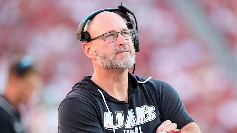 UAB Blazers head coach Trent Dilfer looks up at the scoreboard during a game against the Arkansas Razorbacks.
