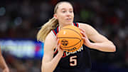 Apr 6, 2025; Tampa, FL, USA; Connecticut Huskies guard Paige Bueckers (5) passes the ball against the South Carolina Gamecocks during the first half of the national championship of the women's 2025 NCAA tournament at Amalie Arena. Mandatory Credit: Nathan Ray Seebeck-Imagn Images