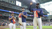 Jul 14, 2024; Houston, Texas, USA; Houston Astros second baseman Jose Altuve (27) and right fielder Kyle Tucker (30) look on as designated hitter Yordan Alvarez (44) waves to the crowd before the game against the Texas Rangers at Minute Maid Park. 