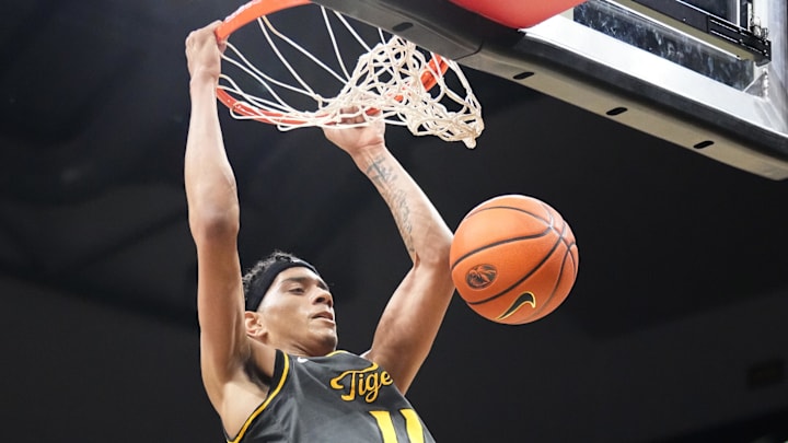 Dec 14, 2024; Columbia, Missouri, USA; Missouri Tigers guard Trent Pierce (11) dunks the ball against the LIU Sharks during the first half at Mizzou Arena. Mandatory Credit: Denny Medley-Imagn Images