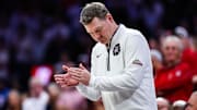 Arizona Wildcats head coach Tommy Lloyd claps his hands during the first half against the Houston Cougars at McKale Center. 
