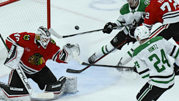 Dec 29, 2024; Chicago, Illinois, USA;  Chicago Blackhawks goaltender Arvid Soderblom (40) defends against Dallas Stars center Roope Hintz (24) and center Wyatt Johnston (53) during the second period at United Center. Mandatory Credit: Matt Marton-Imagn Images