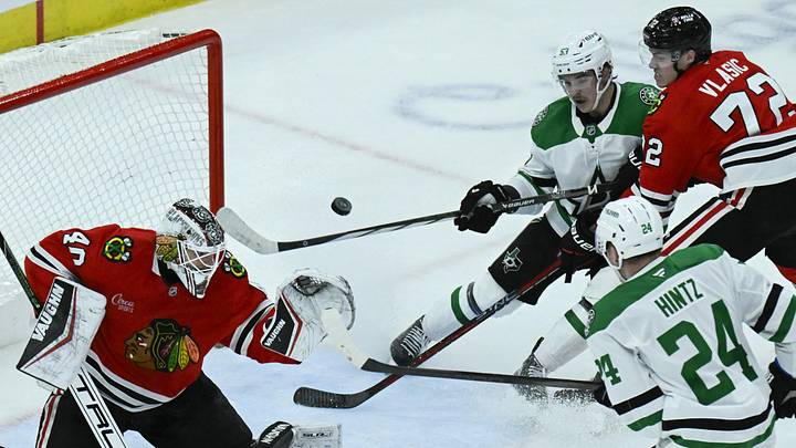 Dec 29, 2024; Chicago, Illinois, USA;  Chicago Blackhawks goaltender Arvid Soderblom (40) defends against Dallas Stars center Roope Hintz (24) and center Wyatt Johnston (53) during the second period at United Center. Mandatory Credit: Matt Marton-Imagn Images