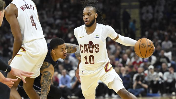 Apr 20, 2024; Cleveland, Ohio, USA; Cleveland Cavaliers guard Darius Garland (10) dribbles around Orlando Magic guard Markelle Fultz (20) in the second quarter during game one of the first round for the 2024 NBA playoffs at Rocket Mortgage FieldHouse. Mandatory Credit: David Richard-USA TODAY Sports