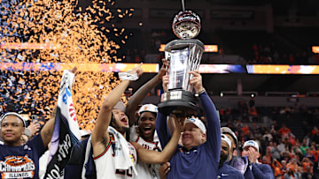 Mar 17, 2024; Minneapolis, MN, USA; Illinois Fighting Illini  head coach Brad Underwood celebrates with forward Ty Rodgers (20) after defeating Wisconsin Badgers at Target Center. Mandatory Credit: Matt Krohn-Imagn Images