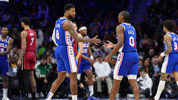Feb 5, 2025; Philadelphia, Pennsylvania, USA; Philadelphia 76ers forward Paul George (8) reacts with guard Tyrese Maxey (0) against the Miami Heat in the first quarter at Wells Fargo Center. Mandatory Credit: Kyle Ross-Imagn Images