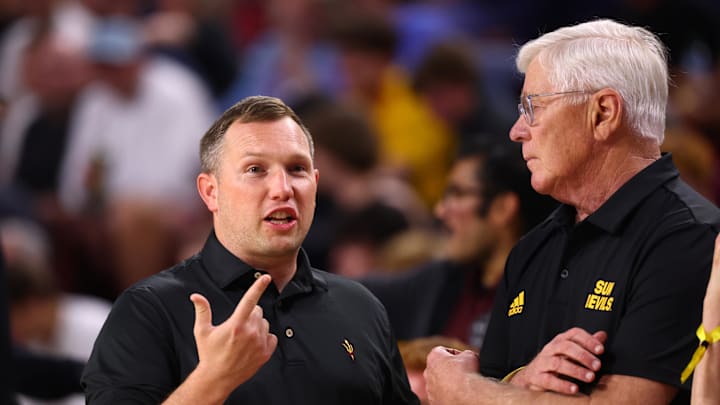 Mar 3, 2026; Tempe, Arizona, USA; Arizona State Sun Devils head football coach Kenny Dillingham (left) with booster Jay Blegen against the Kansas Jayhawks at Desert Financial Arena. Mandatory Credit: Mark J. Rebilas-Imagn Images
