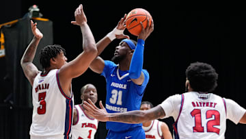 Mar 10, 2023; Frisco, TX, USA;  Middle Tennessee Blue Raiders forward Jared Coleman-Jones (31) scores a basket against Florida Atlantic Owls forward Giancarlo Rosado (3) during the first half at Ford Center at The Star. Mandatory Credit: Chris Jones-USA TODAY Sports