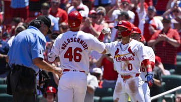 Jun 13, 2024; St. Louis, Missouri, USA;  St. Louis Cardinals first baseman Paul Goldschmidt (46) is congratulated by shortstop Masyn Winn (0) after hitting a two run home run against the Pittsburgh Pirates during the third inning at Busch Stadium. Mandatory Credit: Jeff Curry-USA TODAY Sports