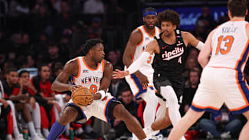 Mar 30, 2025; New York, New York, USA; New York Knicks forward OG Anunoby (8) is guarded by Portland Trail Blazers guard Matisse Thybulle (4) during the first half at Madison Square Garden. Mandatory Credit: Vincent Carchietta-Imagn Images