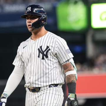 Jul 5, 2024; Bronx, New York, USA;  New York Yankees second baseman Gleyber Torres (25) reacts after safely reaching first base on an infield single during the fourth inning against the Boston Red Sox at Yankee Stadium. Torres would leave the game with an injury after the play. Mandatory Credit: Vincent Carchietta-USA TODAY Sports