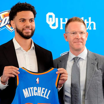 Ajay Mitchell stands with Thunder general manager Sam Presti during an introductory press conference for the 2024 Thunder draft picks at Oklahoma Contemporary Arts Center in Oklahoma City, Saturday, June, 29, 2024.