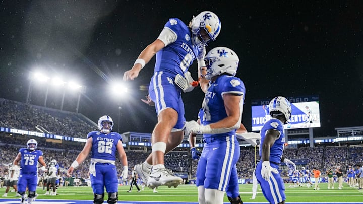 Kentucky Wildcats quarterback Cutter Boley (8), left, celebrates his touchdown pass to Kentucky Wildcats tight end Willie Rodriguez (81) in the second quarter as the Wildcats are rolling in the football game against Eastern Michigan at Kroger Field in Lexington, Kentucky Saturday, Sept. 13, 2025.