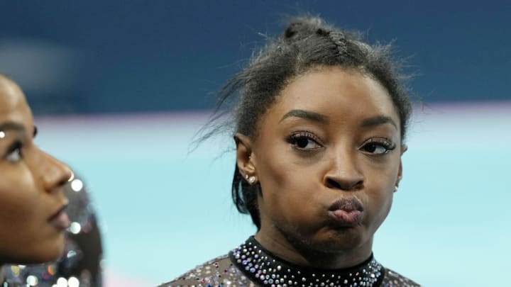 Jul 28, 2024; Paris, France; Simone Biles of the United States reacts after womenís qualification during the Paris 2024 Olympic Summer Games at Bercy Arena. Mandatory Credit: Kyle Terada-USA TODAY Sports