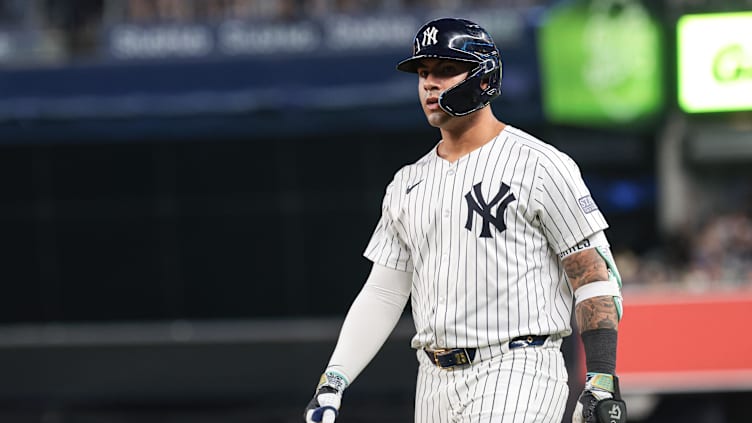 Jul 5, 2024; Bronx, New York, USA;  New York Yankees second baseman Gleyber Torres (25) reacts after safely reaching first base on an infield single during the fourth inning against the Boston Red Sox at Yankee Stadium. Torres would leave the game with an injury after the play. Mandatory Credit: Vincent Carchietta-USA TODAY Sports