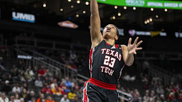 Mar 7, 2025; Kansas City, MO, USA; Texas Tech Lady Raiders guard Loghan Johnson (23) lays the ball up on a breakaway against the Oklahoma State Cowgirls during the second half at T-Mobile Center. Mandatory Credit: Amy Kontras-Imagn Images