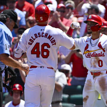 Jun 13, 2024; St. Louis, Missouri, USA;  St. Louis Cardinals first baseman Paul Goldschmidt (46) is congratulated by shortstop Masyn Winn (0) after hitting a two run home run against the Pittsburgh Pirates during the third inning at Busch Stadium. Mandatory Credit: Jeff Curry-USA TODAY Sports