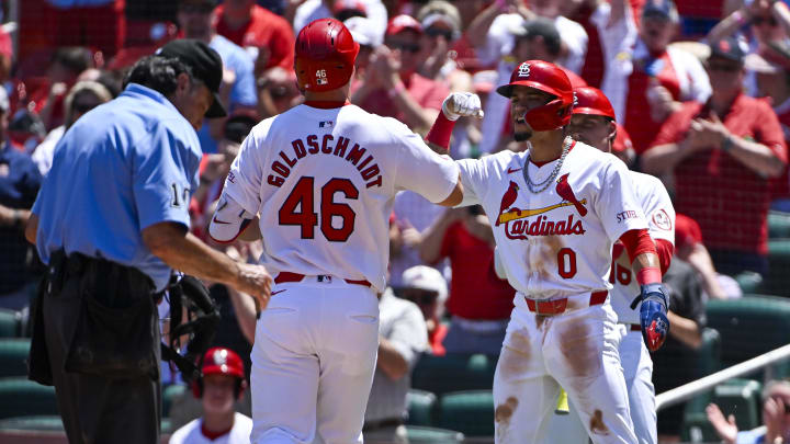 Jun 13, 2024; St. Louis, Missouri, USA;  St. Louis Cardinals first baseman Paul Goldschmidt (46) is congratulated by shortstop Masyn Winn (0) after hitting a two run home run against the Pittsburgh Pirates during the third inning at Busch Stadium. Mandatory Credit: Jeff Curry-USA TODAY Sports