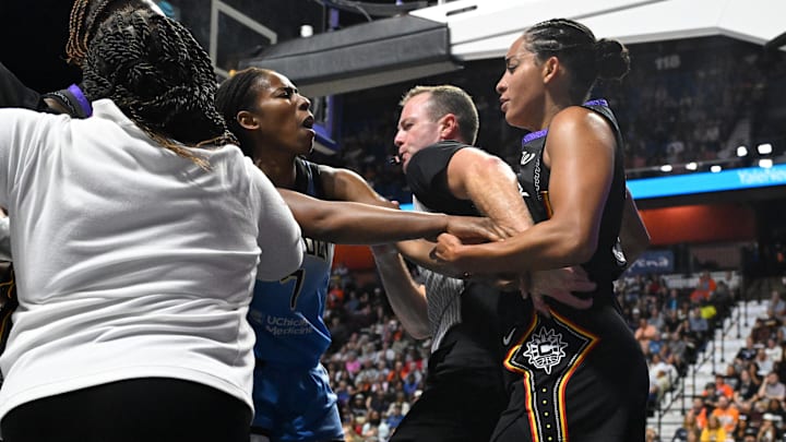 Aug 13, 2025; Uncasville, Connecticut, USA; Chicago Sky guard Ariel Atkins (7) advances on Connecticut Sun guard Bria Hartley (14) both players were ejected from the game during the first half at Mohegan Sun Arena. Mandatory Credit: Eric Canha-Imagn Images Aug 13, 2025; Uncasville, Connecticut, USA; Chicago Sky guard Ariel Atkins (7) advances on Connecticut Sun guard Bria Hartley (14) both players were ejected from the game during the first half at Mohegan Sun Arena. Mandatory Credit: Eric Canha-Imagn Images