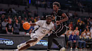 Dec 3, 2025; Atlanta, Georgia, USA; Georgia Tech Yellow Jackets forward Baye Ndongo (11) drives on Mississippi State Bulldogs center Quincy Ballard (15) in the second half at McCamish Pavilion. Mandatory Credit: Brett Davis-Imagn Images