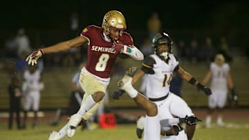 Florida High junior Micahi Danzy (8) leaps through the air in the Class 2S state semifinal matchup between Florida High and Bishop Verot on Dec. 2, 2022, at Mike Hickman Stadium. The Seminoles won, 38-28.

J9t8323