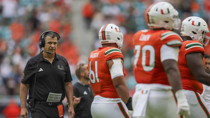 Nov 18, 2023; Miami Gardens, Florida, USA; Miami Hurricanes head coach Mario Cristobal looks on from the field against the Louisville Cardinals during the third quarter at Hard Rock Stadium. Mandatory Credit: Sam Navarro-USA TODAY Sports