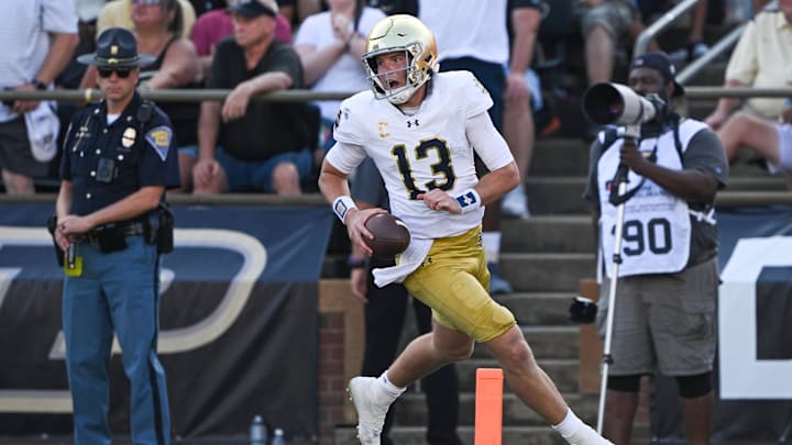 Sep 14, 2024; West Lafayette, Indiana, USA; Notre Dame Fighting Irish quarterback Riley Leonard (13) reacts after scoring a touchdown against the Purdue Boilermakers during the second quarter at Ross-Ade Stadium.