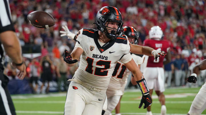 Sep 10, 2022; Fresno, California, USA; Oregon State Beavers running back Jack Colletto (12) flips the ball to an official after scoring a touchdown against the Fresno State Bulldogs on the final play of the game at Valley Children's Stadium. Mandatory Credit: Cary Edmondson-USA TODAY Sports