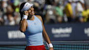 Emma Raducanu celebrates after her match against Amanda Anisimova at the Miami Open.