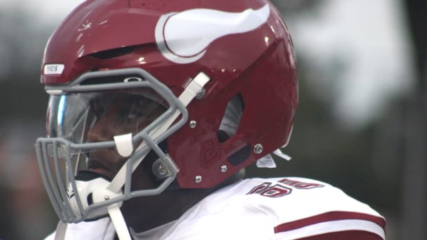 Raines offensive lineman Solomon Thomas (65) prepares to call the coin toss before a high school football game at Bolles on A