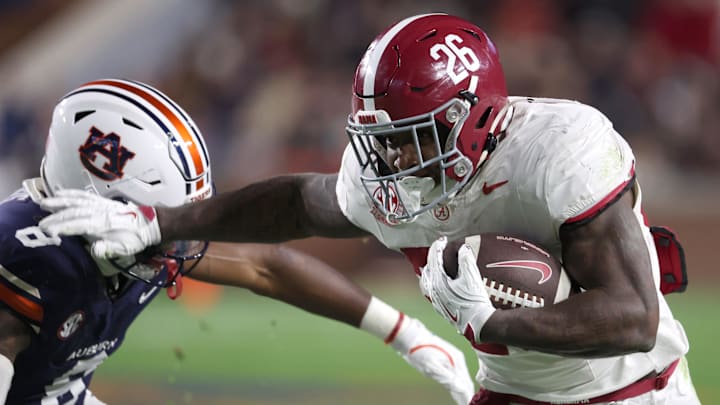 Alabama running back Jam Miller gets past Auburn safety Kaleb Harris in the Tide’s win.