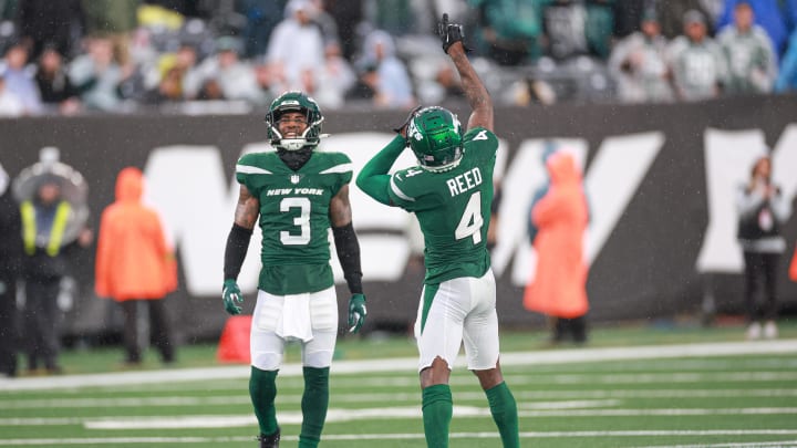 Dec 10, 2023; East Rutherford, New Jersey, USA; New York Jets cornerback D.J. Reed (4) and safety Jordan Whitehead (3) celebrate a defensive stop during the second half against the Houston Texans at MetLife Stadium.