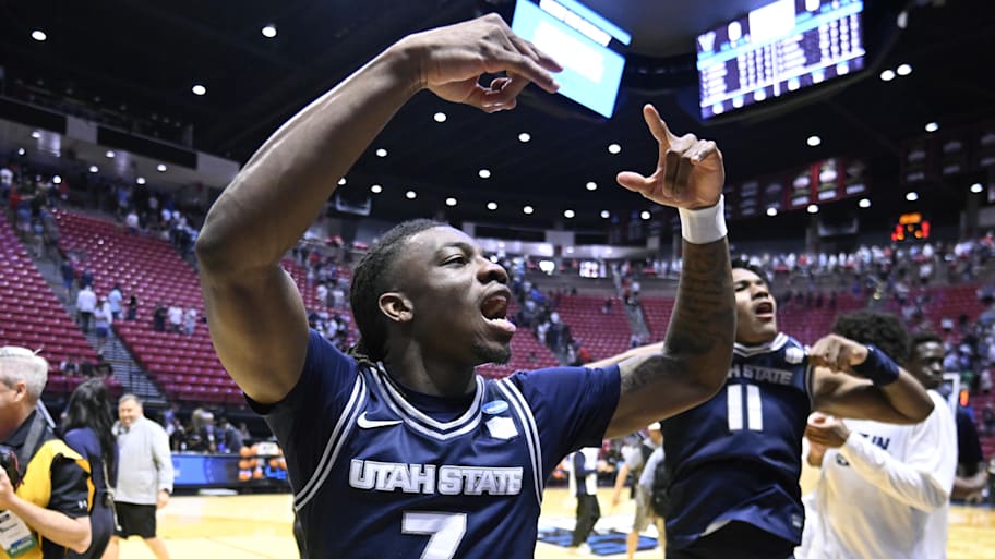 Utah State Aggies guard Kolby King reacts after defeating the Villanova Wildcats in the first round of the NCAA tournament.
