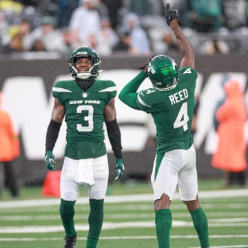 Dec 10, 2023; East Rutherford, New Jersey, USA; New York Jets cornerback D.J. Reed (4) and safety Jordan Whitehead (3) celebrate a defensive stop during the second half against the Houston Texans at MetLife Stadium.