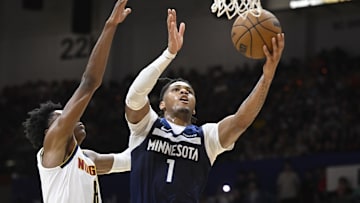 Oct 4, 2025; San Diego, California, USA; Minnesota Timberwolves guard Terrence Shannon Jr. (1) shoots past Denver Nuggets forward Peyton Watson (8) during the second half at Pechanga Arena. Mandatory Credit: Denis Poroy-Imagn Images