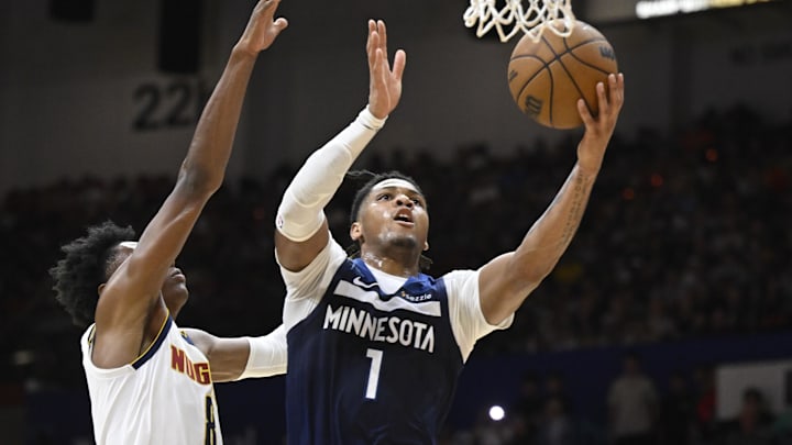 Oct 4, 2025; San Diego, California, USA; Minnesota Timberwolves guard Terrence Shannon Jr. (1) shoots past Denver Nuggets forward Peyton Watson (8) during the second half at Pechanga Arena. Mandatory Credit: Denis Poroy-Imagn Images
