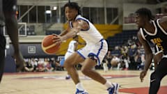 Former Kentucky guard DJ Wagner extends for basketball before it creeps out of bounds.