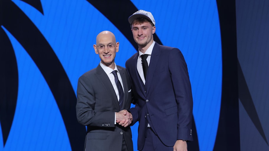 Cooper Flagg poses with NBA commissioner Adam Silver after being selected as by the Dallas Mavericks.