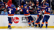 Mar 20, 2025; Elmont, New York, USA; New York Islanders center Bo Horvat (14) celebrates his game winning goal against the Montreal Canadiens with center Casey Cizikas (53) and defensemen Noah Dobson (8) and Tony DeAngelo (4) during overtime at UBS Arena. Mandatory Credit: Brad Penner-Imagn Images